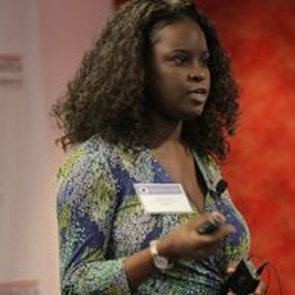 Sade speaking at a conference